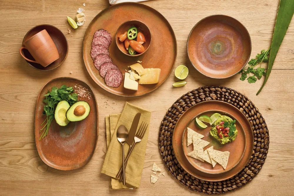 warm terracotta orange tableware table setting with food