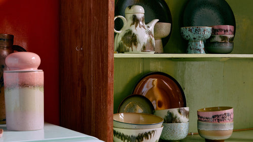 colorful ceramics with retro design in kitchen cabinet