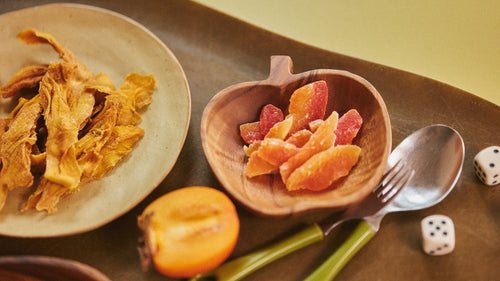 teak wood serving board with fresh grapefruit