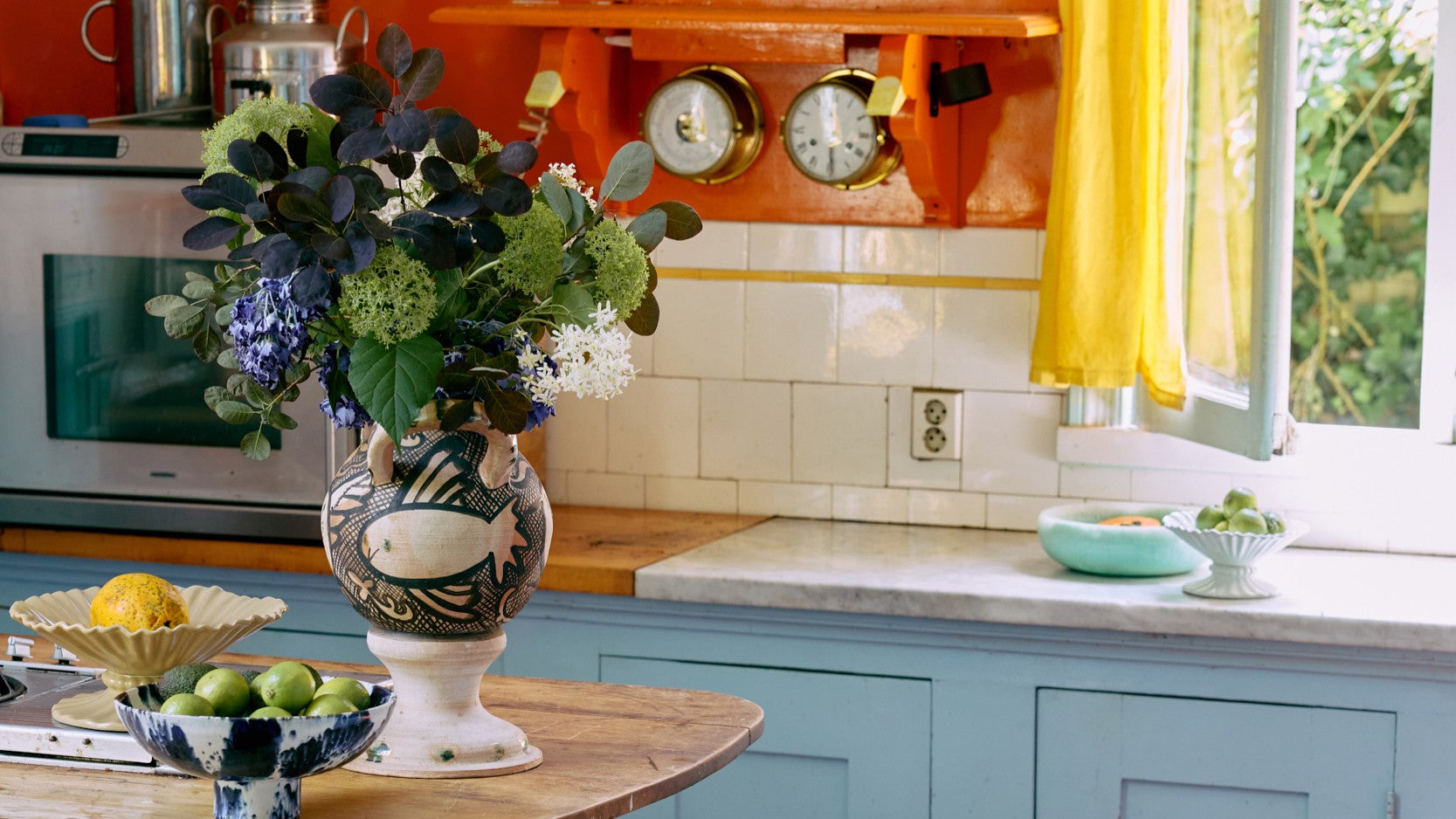 colorful kitchen with vase with flowers