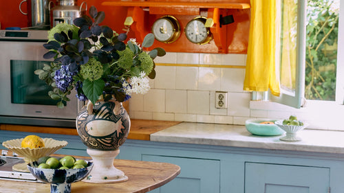 colorful kitchen with vase with flowers