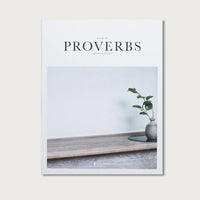 Book titled 'Proverbs' with a minimalistic cover featuring a vase and plant on a wooden shelf.