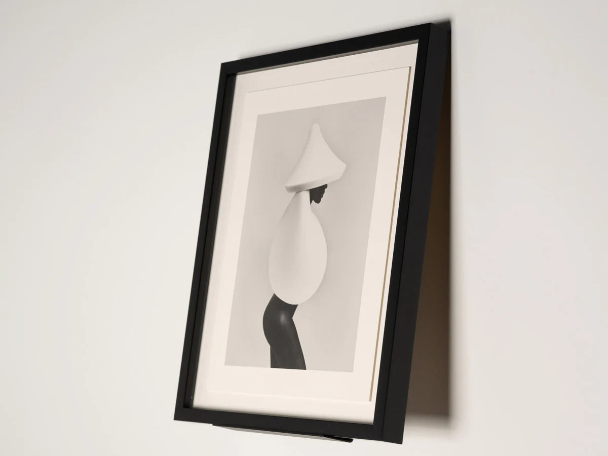 wall stand with framed artwork on white background