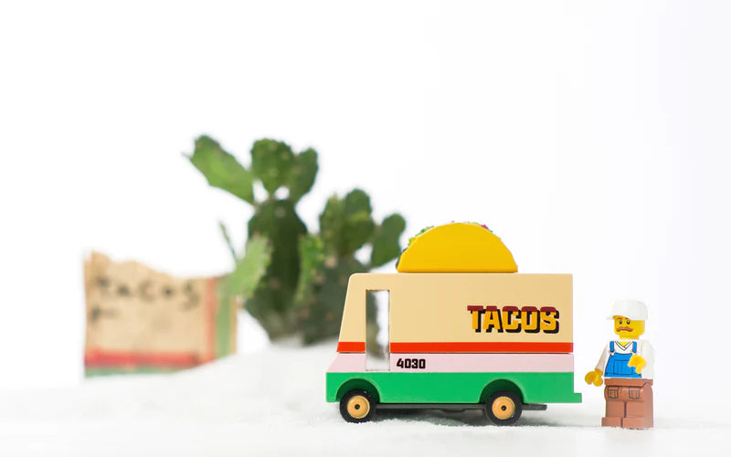 Toy taco truck with a figure on a white background