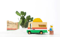 Toy taco truck with a figure on a white background