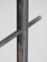 Close-up of a metal rod with a cylindrical cross-section on a white background