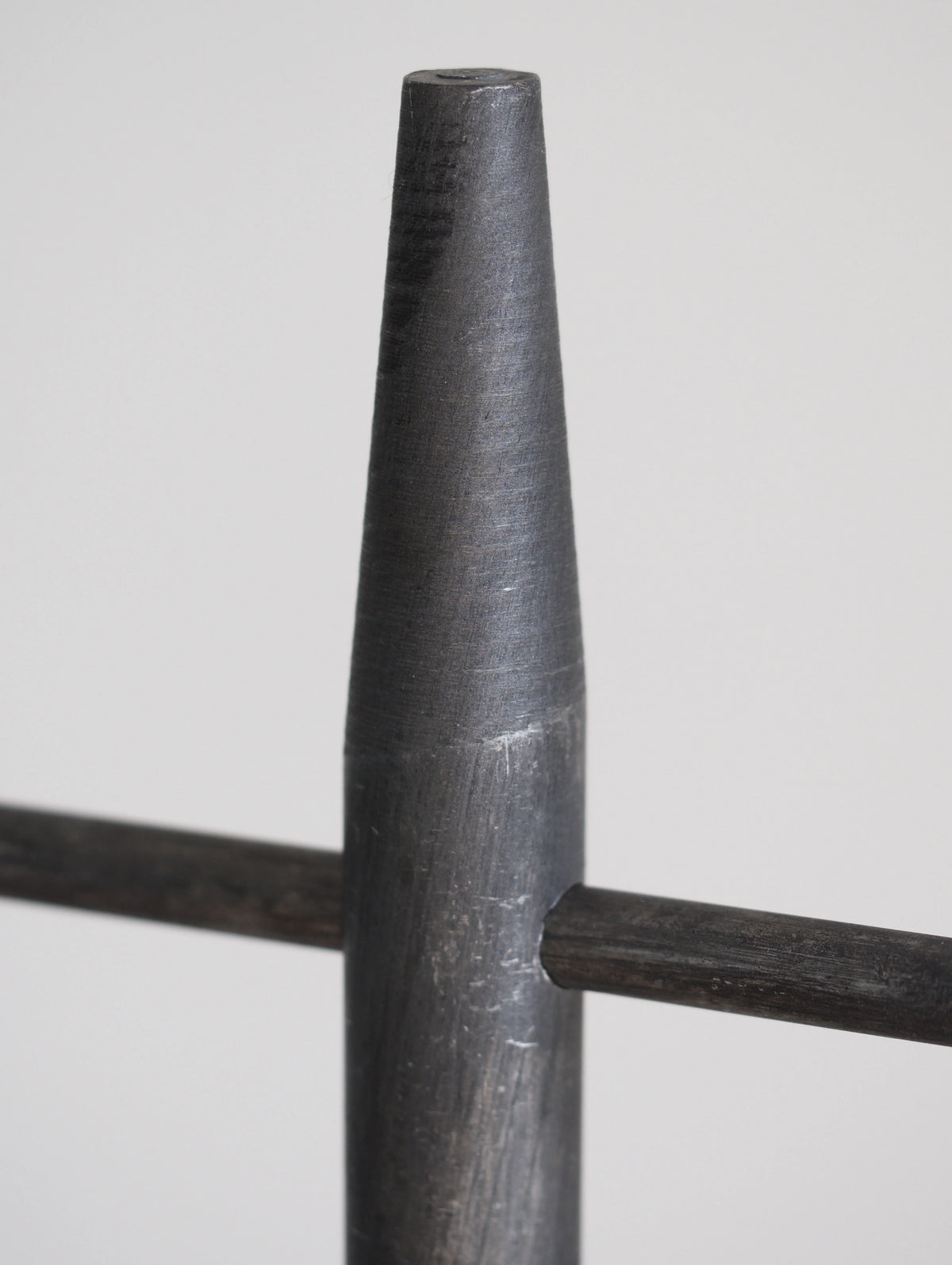 Close-up of a cylindrical metal object on a white background