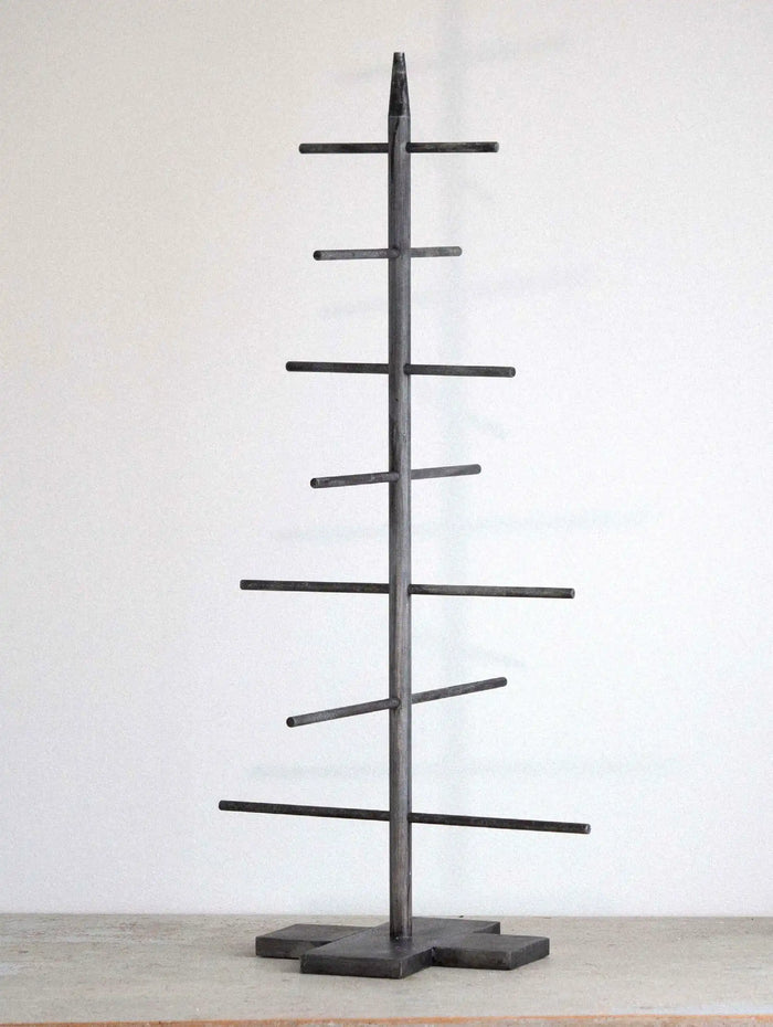 Black metal tree-shaped Christmas tree  on a white background