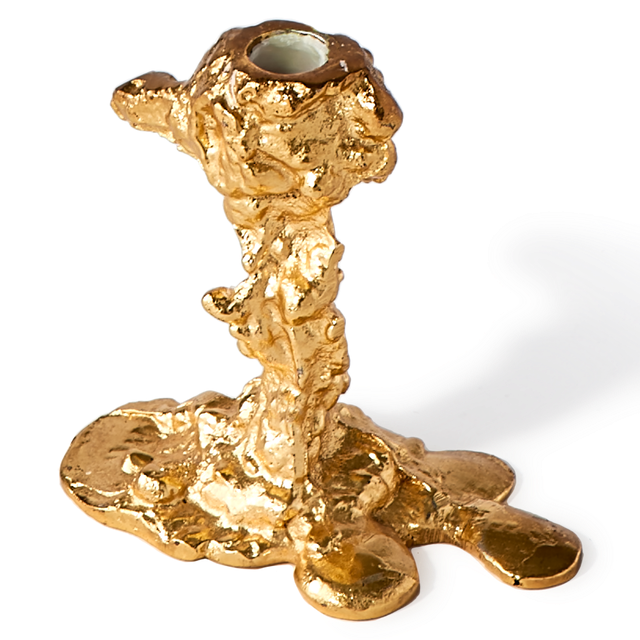 gold colored drip candle stick holder design object