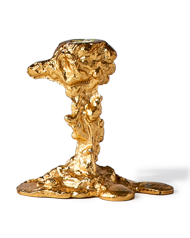 gold colored drip candle stick holder design object