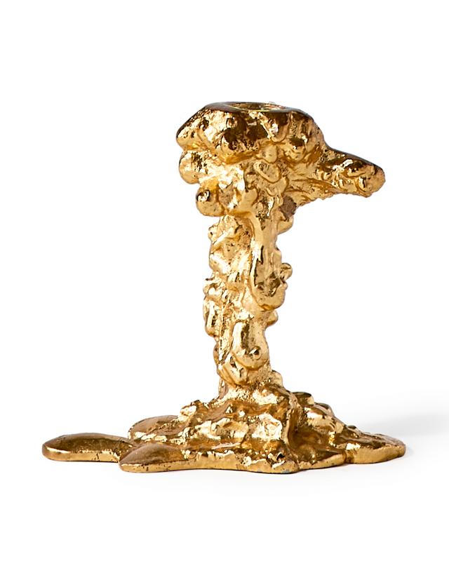 gold colored drip candle stick holder design object