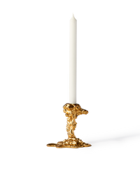 gold colored drip candle stick holder design object