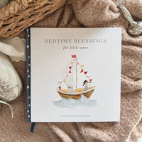 Children's book with title bedtime blessing on a soft blanket with a boot as illustration