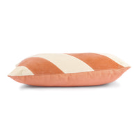 peach and cream colored striped lumbar shape pillow