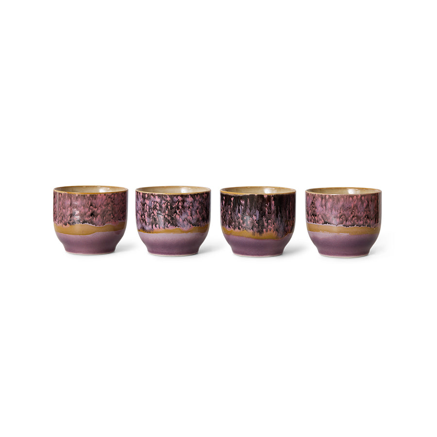 Set of four ceramic cups with a purple and gold gradient on a white background