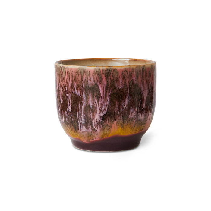 Ceramic cup with marbled design on a white background