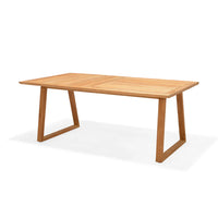 Wooden dining table on a white background