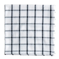 Plaid fabric with black and white pattern on a white background