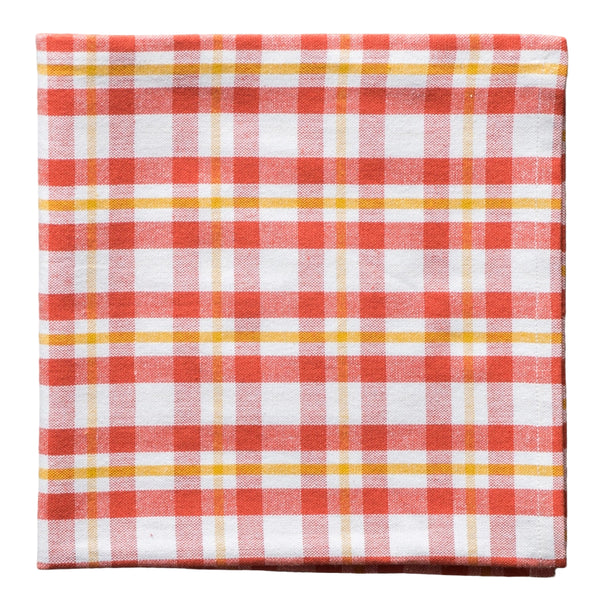 Red, white, and yellow checkered fabric napkin on a white background