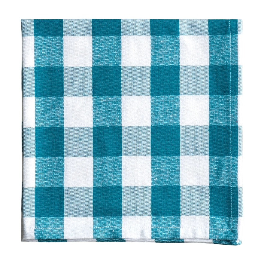 Teal and white checkered fabric napkin on a white background