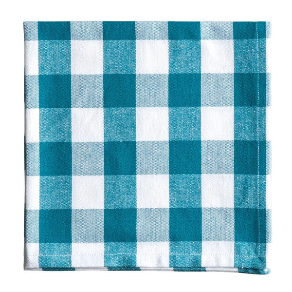 Teal and white checkered fabric napkin on a white background