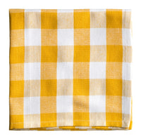 Yellow and white checkered fabric on a white background