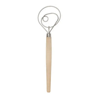 Metal whisk with wooden handle on a white background