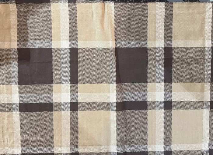 Plaid fabric with brown, beige, and black pattern