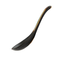 Black ceramic spoon on a white background