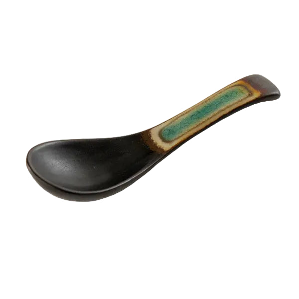 Black spoon with a green and brown handle on a white background