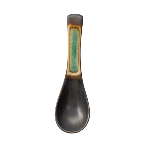 Black ceramic spoon with a green accent on a white background