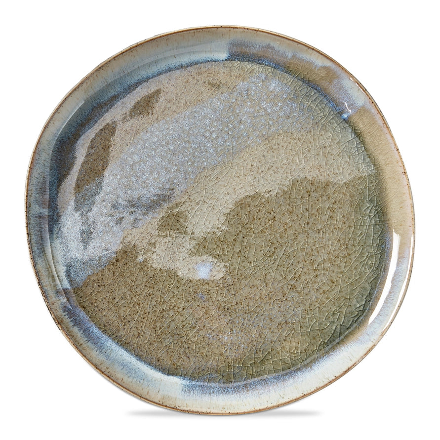 large round plate with reactive glaze glossy finish on a white background
