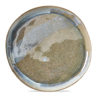 large round plate with reactive glaze glossy finish on a white background