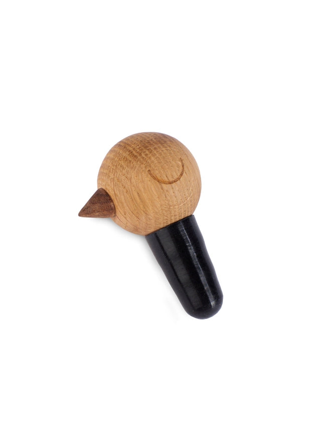 wine stopper with Nordic look made from wood and natural rubber on a white background