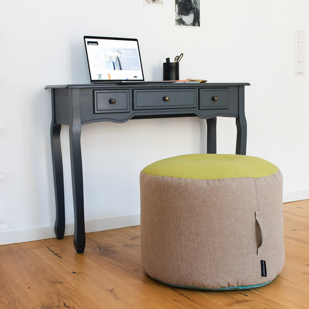 small pouf in beige yellow and teal with desk