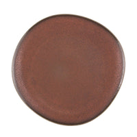 Round brown ceramic plate on a white background