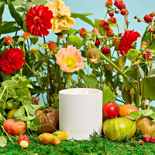white concrete vessel with scented tomato candle