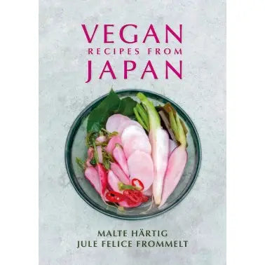 Book cover of 'Vegan Recipes from Japan' with a dish of pickled radish and green beans on a textured gray background.