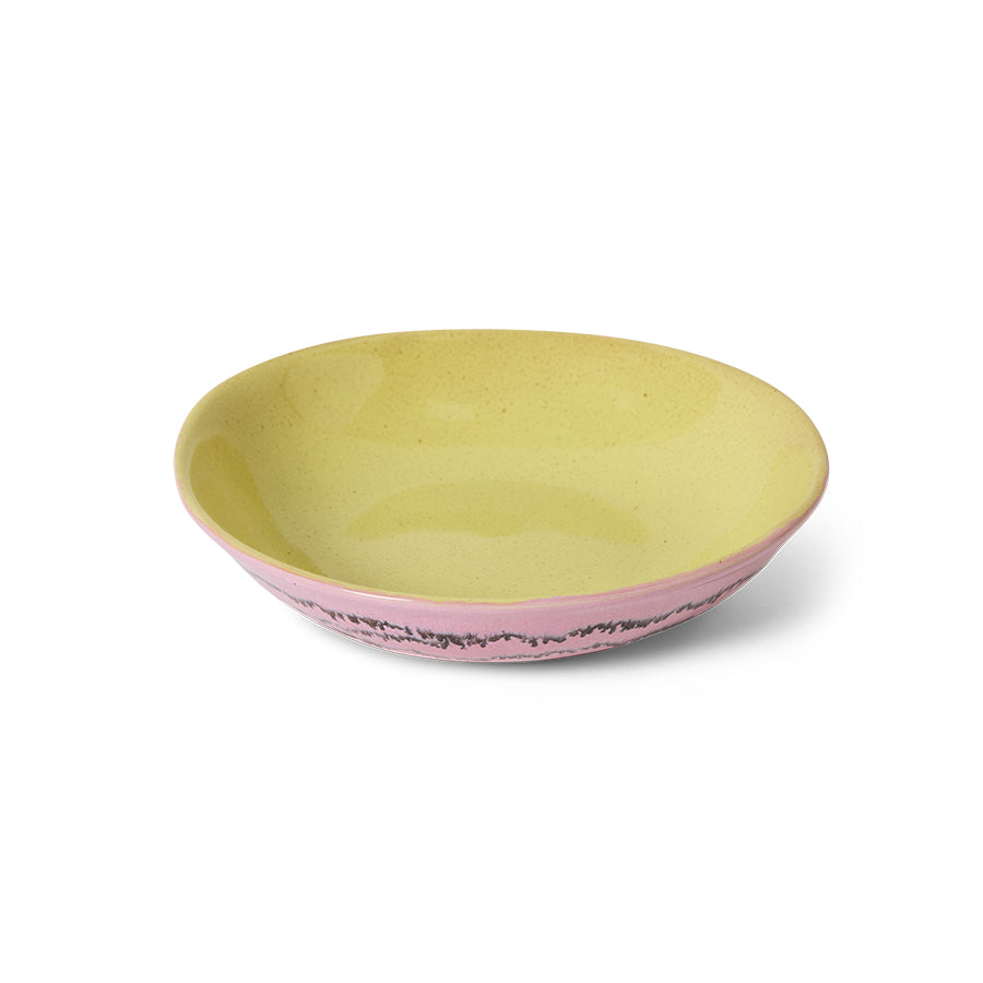 Two-tone ceramic bowl with pink bottom and yellow top on a white background