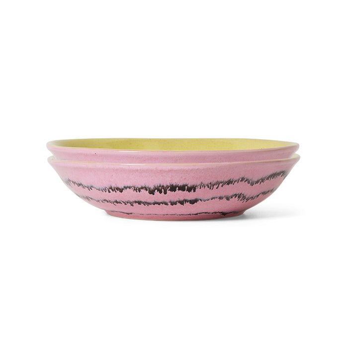 pink and yellow ceramic bowl on a white background