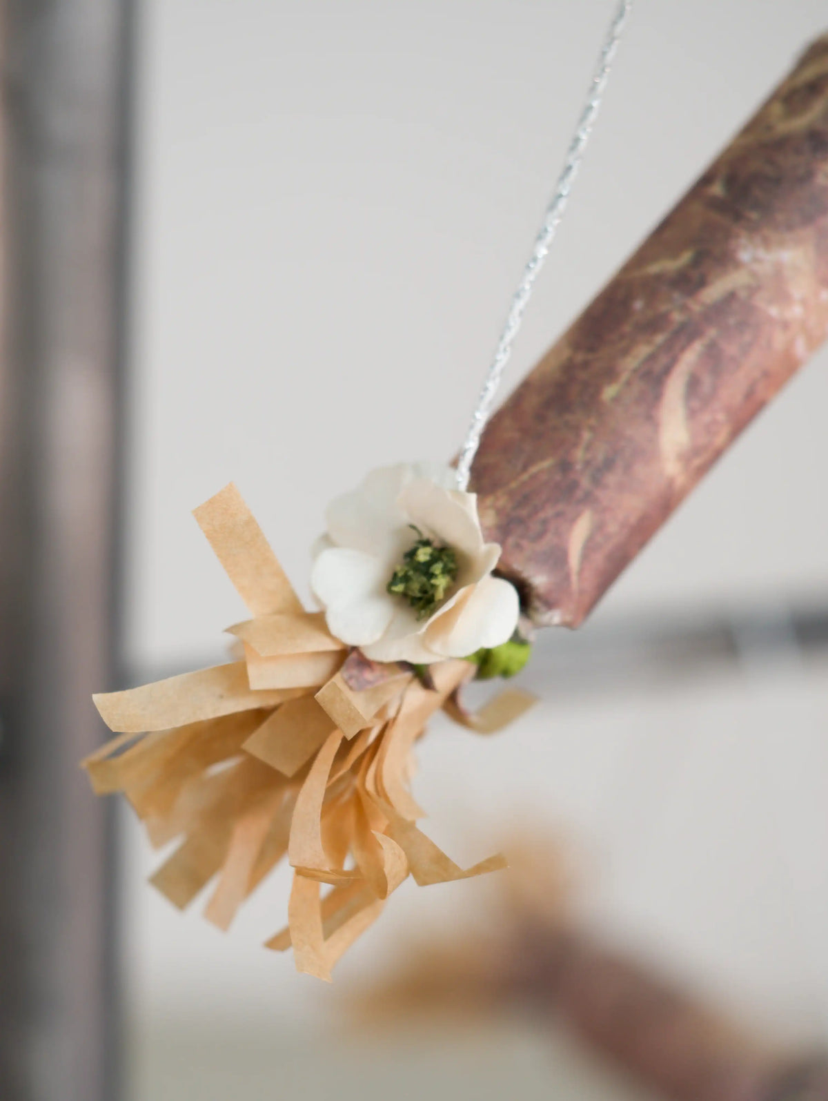 detail of paper cracker with flower Christmas ornament 
