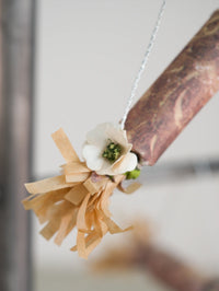 detail of paper cracker with flower Christmas ornament 
