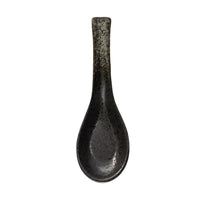 Black ceramic spoon on a white background