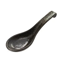 Black ceramic spoon on a white background