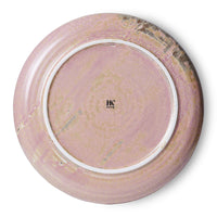 Round ceramic plate with a marbled design on a white background