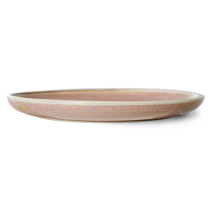round pink  textured cylindrical plate on a white background