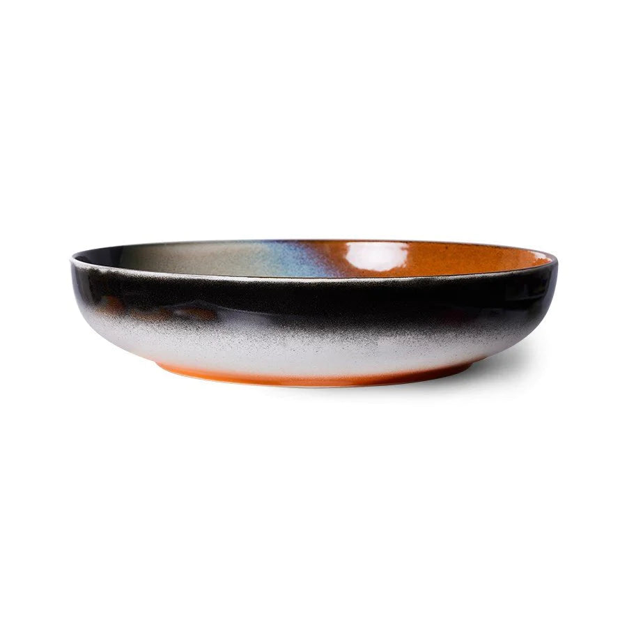 Ceramic bowl with gradient color on a white background