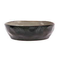 Black ceramic bowl on a white background