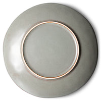 Ceramic plate with a copper rim on a white background