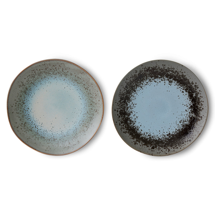 Two ceramic plates with speckled design on a white background